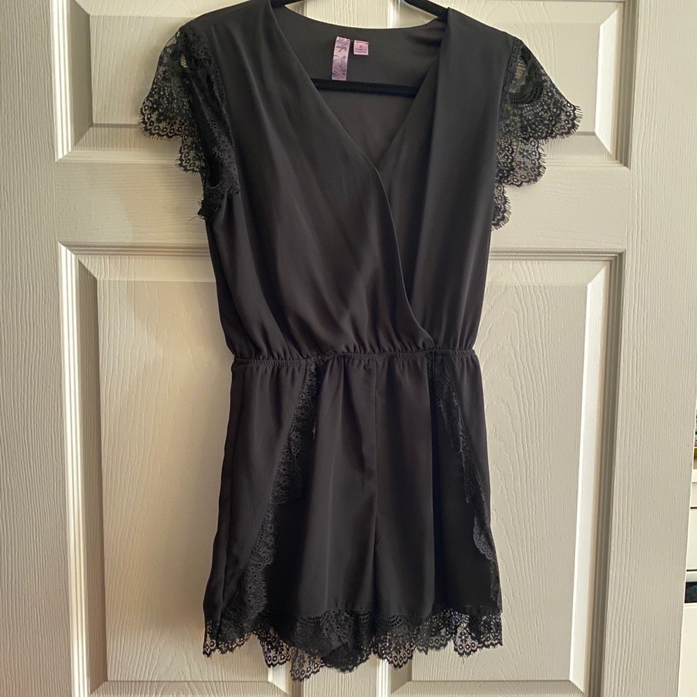 Francesca’s lacey black romper